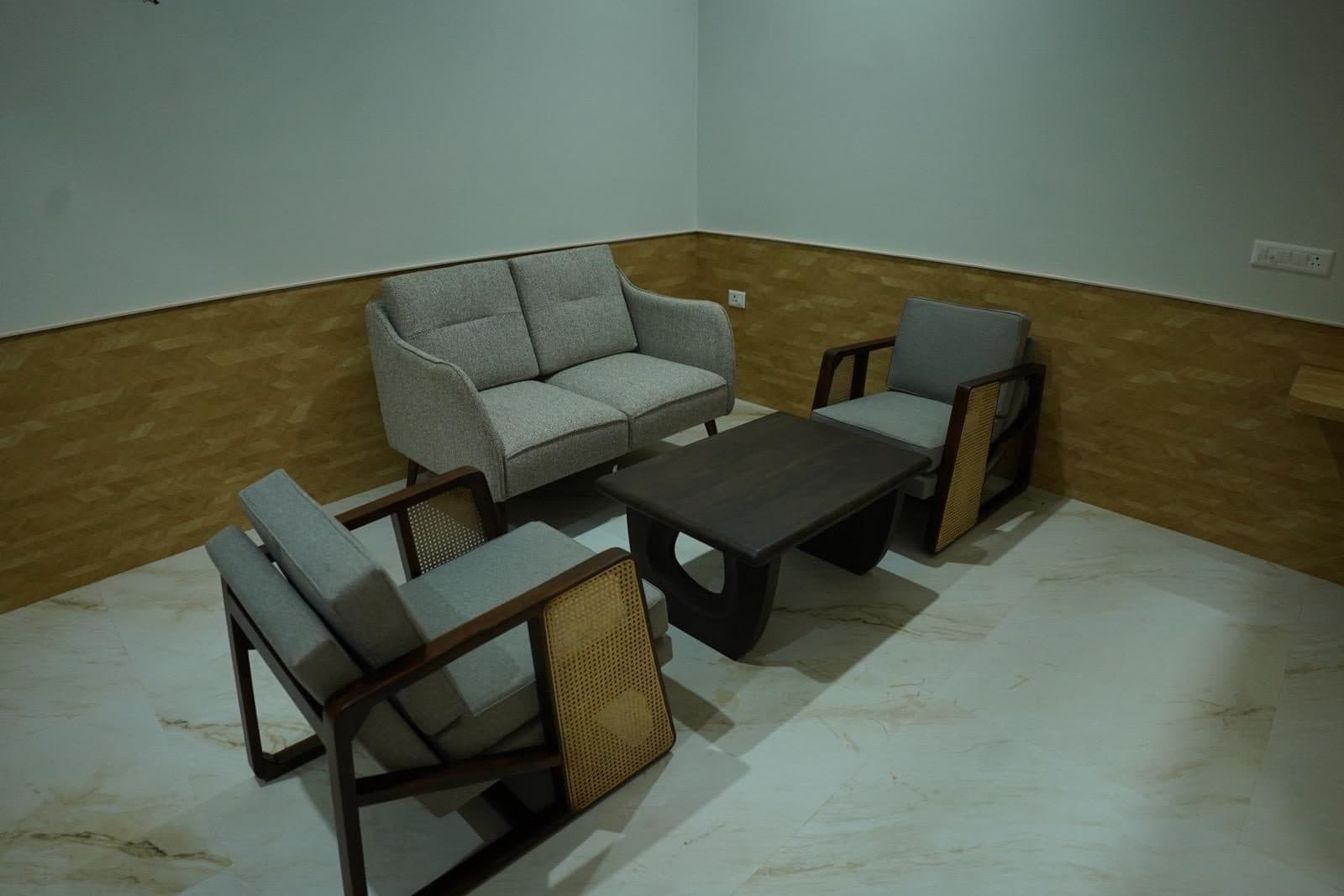 Suite sitting area with sofa and chairs