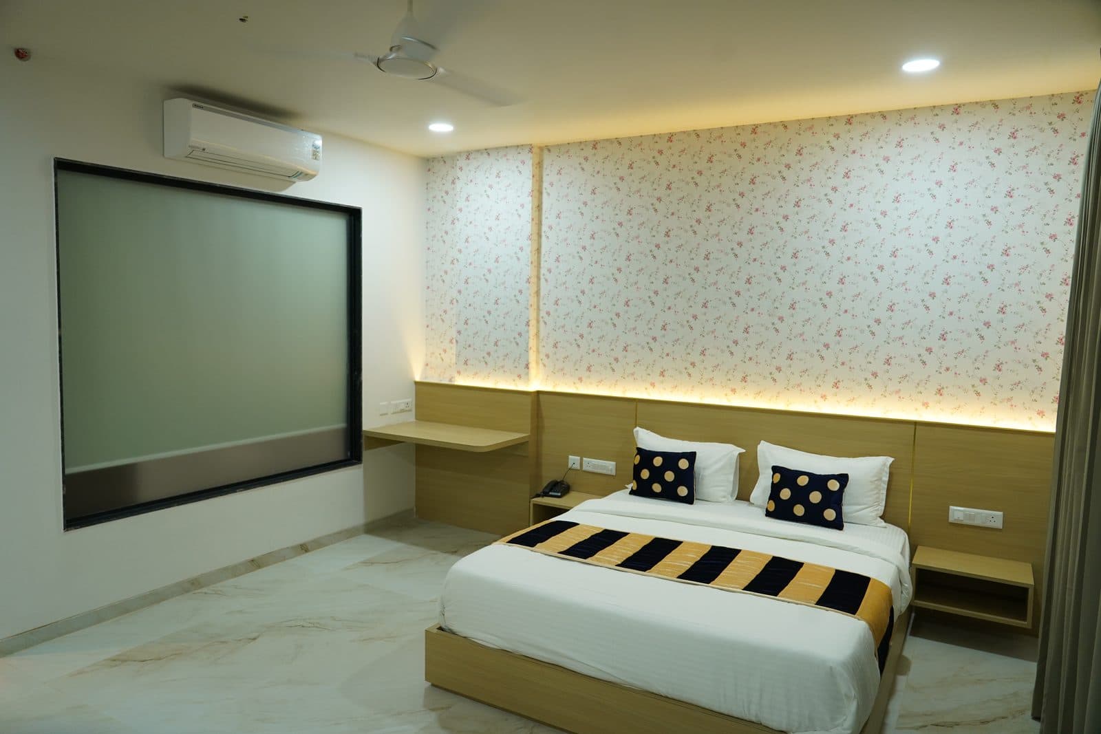 Guest room with floral wallpaper
